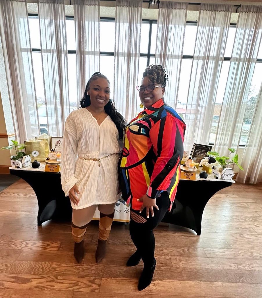 Two attendees with completed vision boards